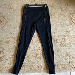 Athleta leggings with leather-like trim, size medium zipper pockets